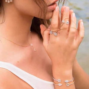 Elegant zircon open jewelry set with teardrop and rectangular stones on model