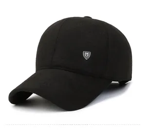 Detail of black wool baseball cap featuring a decorative M 1991 metal shield logo