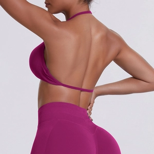 Rear view of purple halter yoga set showing seamless open back bra and high waist leggings