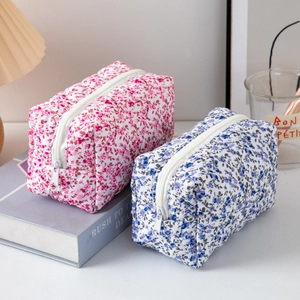 Quilted floral cotton makeup bags in pink and blue with zipper closure and large capacity