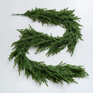 Detailed close-up of flexible green PE pine needle garland for Christmas decor