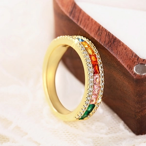 Detailed macro view of rainbow eternity ring with colorful baguette-cut cubic zirconia