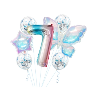 Rainbow gradient butterfly and number 7 foil balloon set with blue confetti balloons