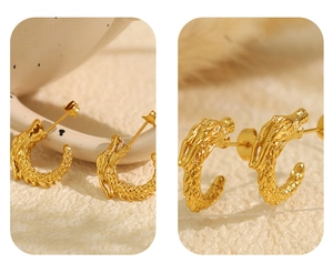 Macro detail of golden dragon-shaped stud earring with intricate 3D scales and textures