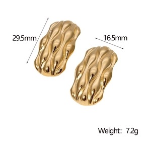 Detail view of gold wavy earrings showing dimensions 29.5mm by 16.5mm and 7.2g weight