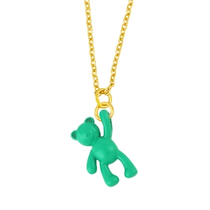 Detail of a minimalist gold necklace featuring a vibrant green teddy bear pendant