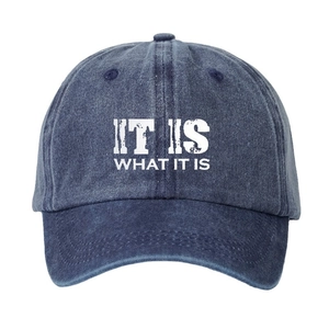 Washed blue denim baseball cap featuring IT IS WHAT IT IS print in a vintage street style
