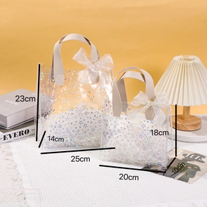 Transparent PVC gift bags with holographic stars and white ribbons in two sizes