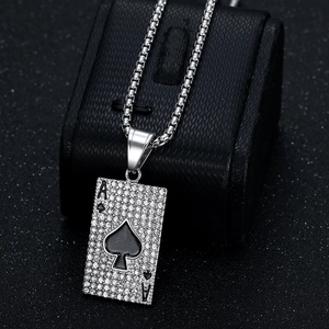 Silver Ace of Spades poker pendant necklace with iced out diamonds on a black jewelry box
