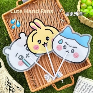 Three cute cartoon animal fans in a picnic basket on grass with summer vibes
