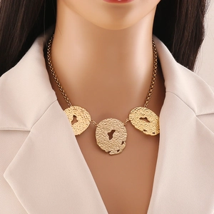 Irregular hammered gold necklace with hollow pendants and stainless steel chain