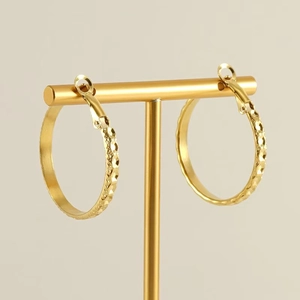 Fashionable gold stainless steel hoop earrings with diamond-cut texture for women