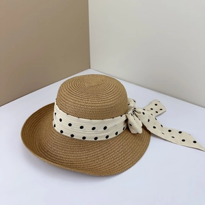 French style straw sun hat with black polka dot bow for beach vacation and seaside summer