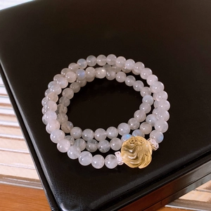 Three-layer moonstone beaded bracelet with yellow citrine charm on black jewelry box