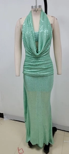 Detail of mint green sequin halter gown showing pleated neckline and fitted fishtail hem