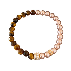 Tiger eye and pearl beaded bracelet with gold zircon spacers on a clean white background
