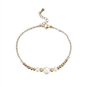 Gold beaded bracelet with white freshwater pearls and adjustable lobster clasp closure