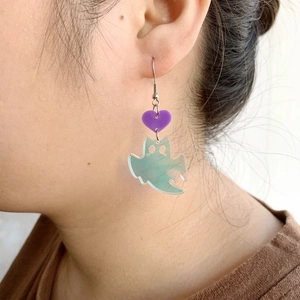 Ghost earrings with purple heart and iridescent green acrylic pendant on female model