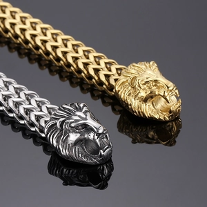 Close-up of hip hop lion head texture on gold and silver stainless steel chain bracelets