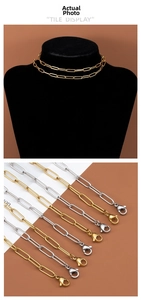Detail view of stainless steel paperclip chains with lobster clasps in gold and silver