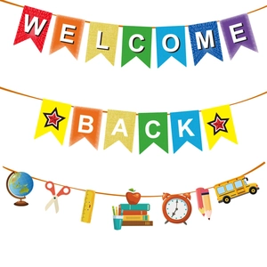 Detail of Welcome Back banner with school icons like globe, bus and pencils for party décor