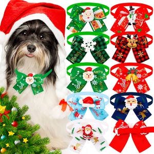 Detail view of festive pet bow ties with 3D Santa and reindeer resin charms and rib ribbons