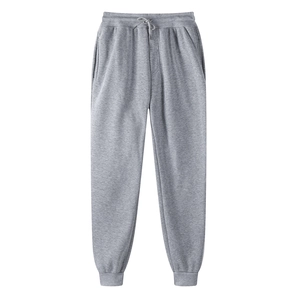 Detail view of gray fleece joggers featuring elastic drawstring waist and side pockets
