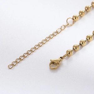 Minimalist gold ball chain stainless steel bracelet featuring lobster clasp and extension