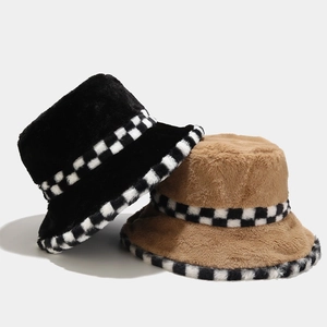 Detail of plush checkerboard fisherman hat with faux fur texture and vintage pattern