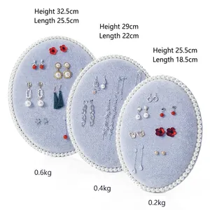Oval light blue velvet jewelry display board set with pearl trim for earrings and necklaces