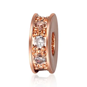 Macro shot of rose gold plated spacer bead with triple row of inlaid clear zircon stones