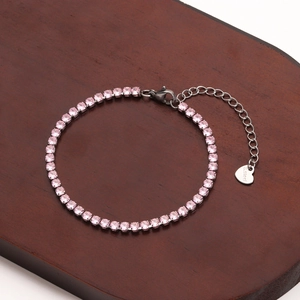 Close-up of pink crystal tennis bracelet in stainless steel with S.steel engraved heart