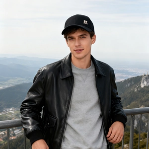 Winter men's wool baseball cap with ear flaps and silver metal R logo on black cotton