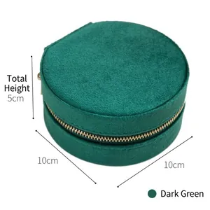 Portable dark green velvet jewelry box with golden zipper and compact round design