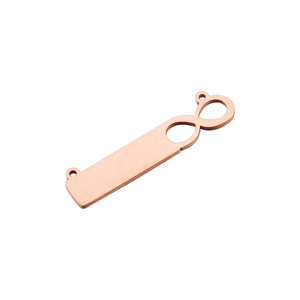 Macro shot of rose gold infinity bar pendant for DIY jewelry making with smooth mirror finish