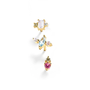 Macro detail of three gold S925 sterling silver stud earrings with colorful gemstones
