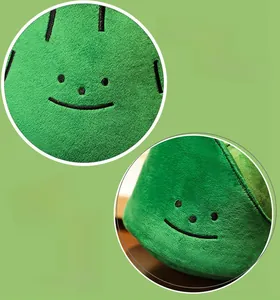Detailed view of the soft plush fabric and embroidered face on the pine tree pillow