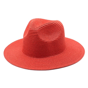 Classic bright red woven straw Panama hat with wide brim for summer sun protection