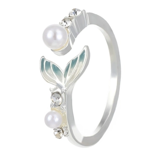 Close-up of silver mermaid tail ring with pearls, crystals, and blue enamel details