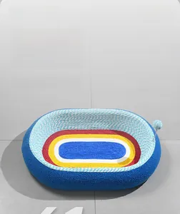 Macro detail of colorful sisal cat scratcher bed with elastic hanging toy ball