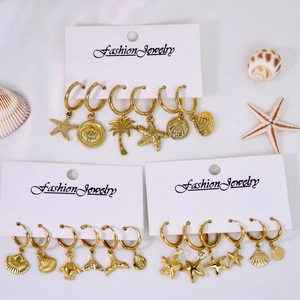 14K gold-plated stainless steel hoop earrings set with starfish and seashell charms
