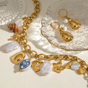 Gold butterfly pearl necklace and ceramic earrings set with vintage charms