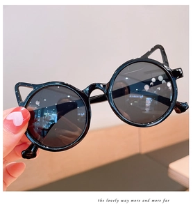 Close-up of black cat-ear round sunglasses for kids with smooth resin frames