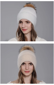 Detailed close-up showing the soft ribbed knit texture and real raccoon fur pompom on the beanie