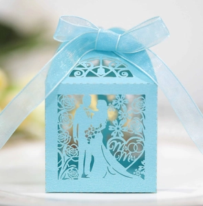 Detailed laser-cut hollow candy box with Mr & Mrs design and blue organza ribbon