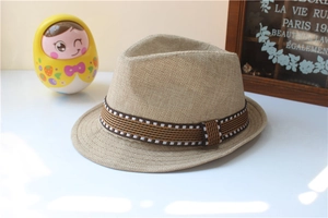 Close-up of linen fedora hat with striped ribbon band and vintage textured weave