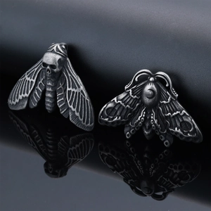 Gothic moth stainless steel pendants with skull and crescent moon on black background