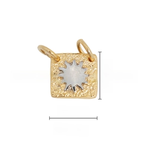Detail of 18k gold plated square pendant with sun motif and hammered metal texture