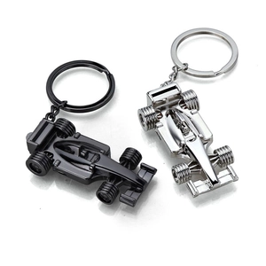F1 formula racing car metal keychain set in black and silver finishes on white background