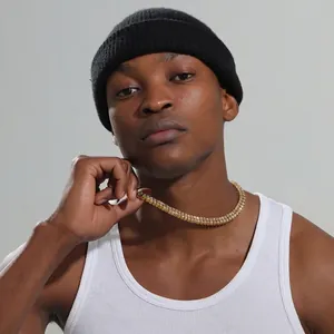 Men's double-row gold tennis chain necklace with white rhinestones on a male model